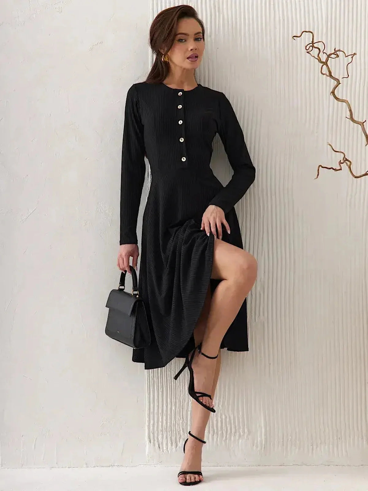 Serene Grace Midi Dress in black, featuring decorative buttons and a flared skirt, perfect for weddings and formal occasions.