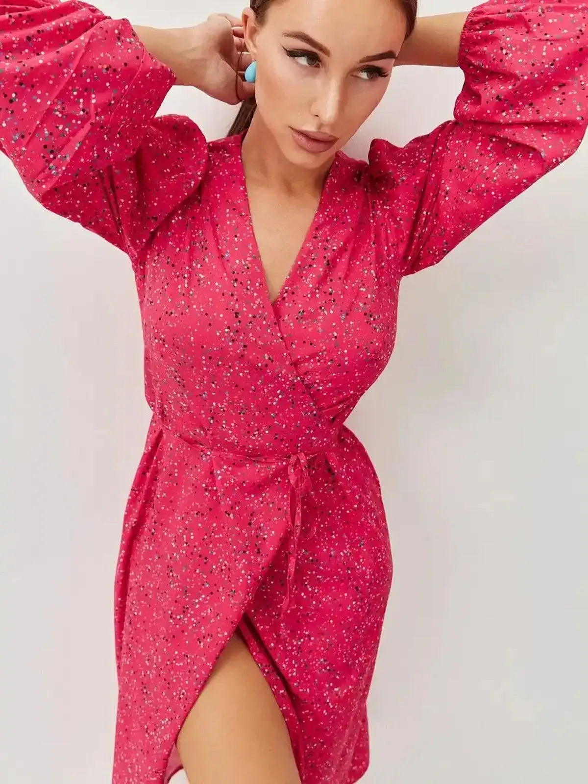 Vibrant pink Confetti Bloom Midi Dress featuring a playful print, wrap silhouette, and elegant slit, perfect for weddings or parties.