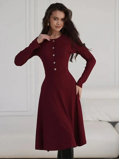 Crimson Grace Midi Dress featuring ribbed texture and gold button detail in burgundy, ideal for weddings and formal occasions.
