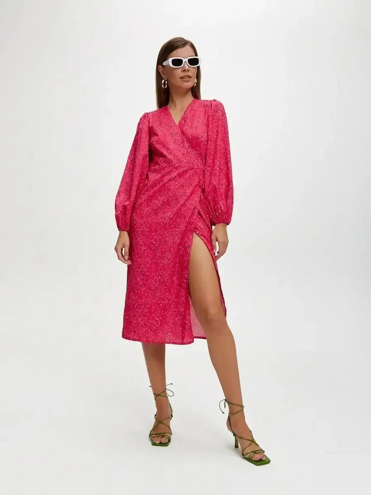 Vibrant pink Confetti Bloom Midi Dress with wrap silhouette and elegant slit, perfect for weddings and summer events.