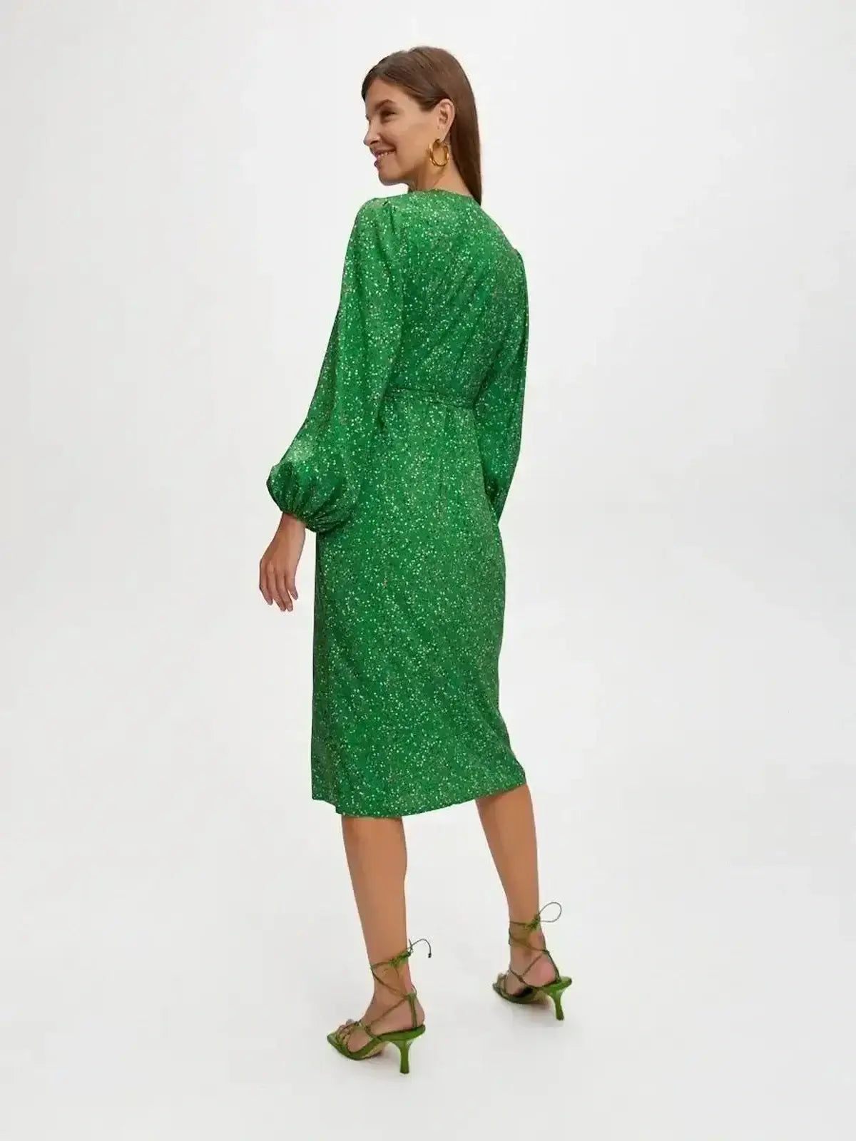 Elegant green midi dress with a wrap design and speckled dot print, perfect for summer weddings and special occasions.