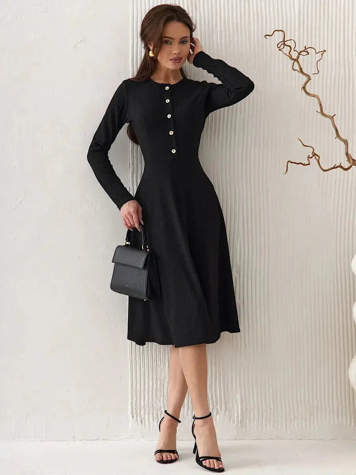 Serene Grace Midi Dress in black ribbed fabric with buttons, perfect for formal occasions or as wedding guest attire.