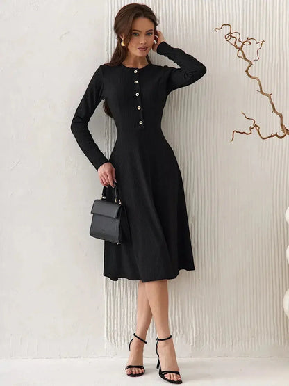 Serene Grace Midi Dress in black ribbed fabric with buttons, perfect for formal occasions or as wedding guest attire.