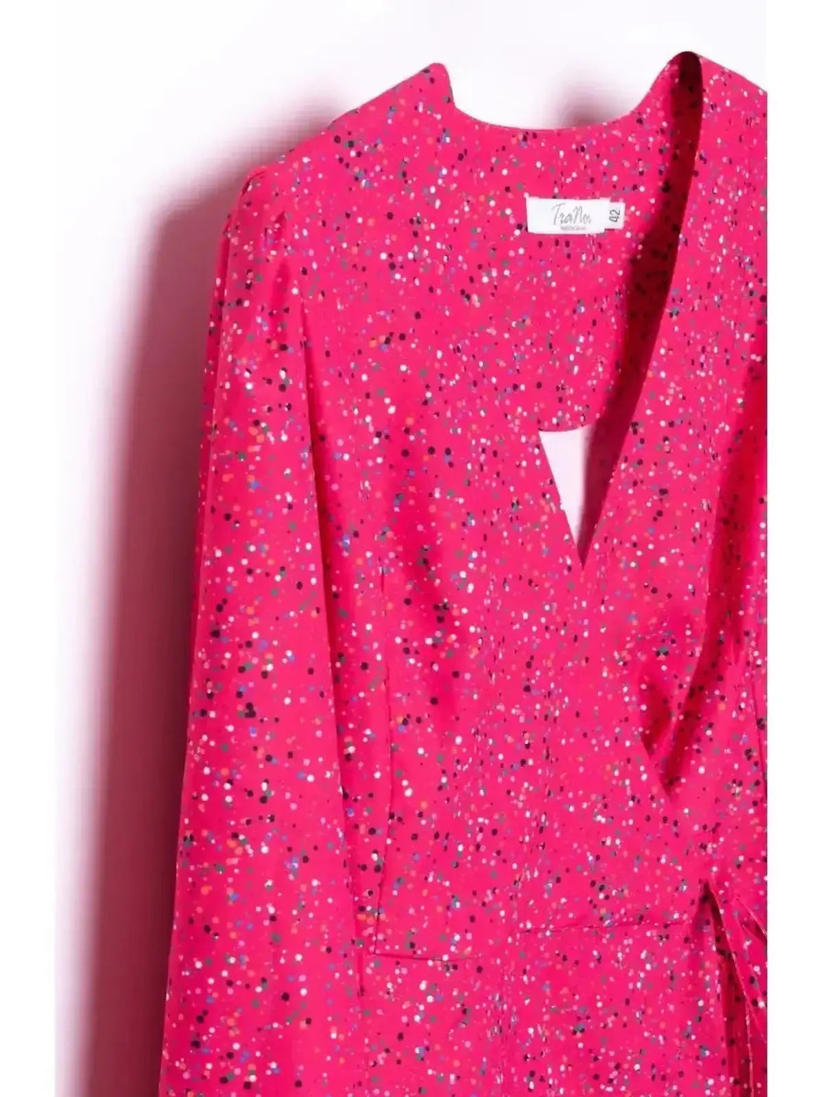 Vibrant pink Confetti Bloom Midi Dress featuring a playful speckled pattern and wrap silhouette.