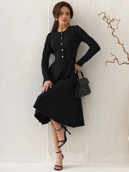 Serene Grace Midi Dress in black ribbed fabric, showcasing a tailored fit with decorative buttons and a flared skirt.