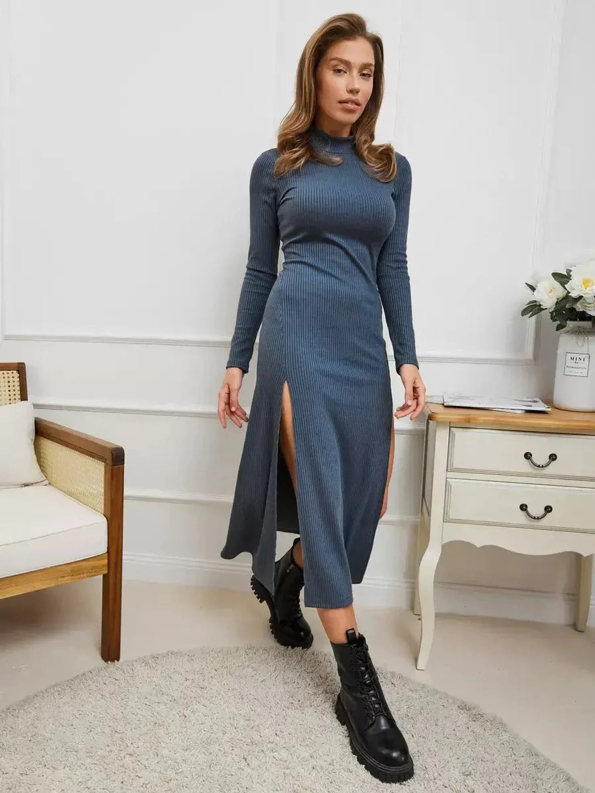 Model wearing a sleek Midnight Slit Midi Dress with bold side slits, styled for a sophisticated look.