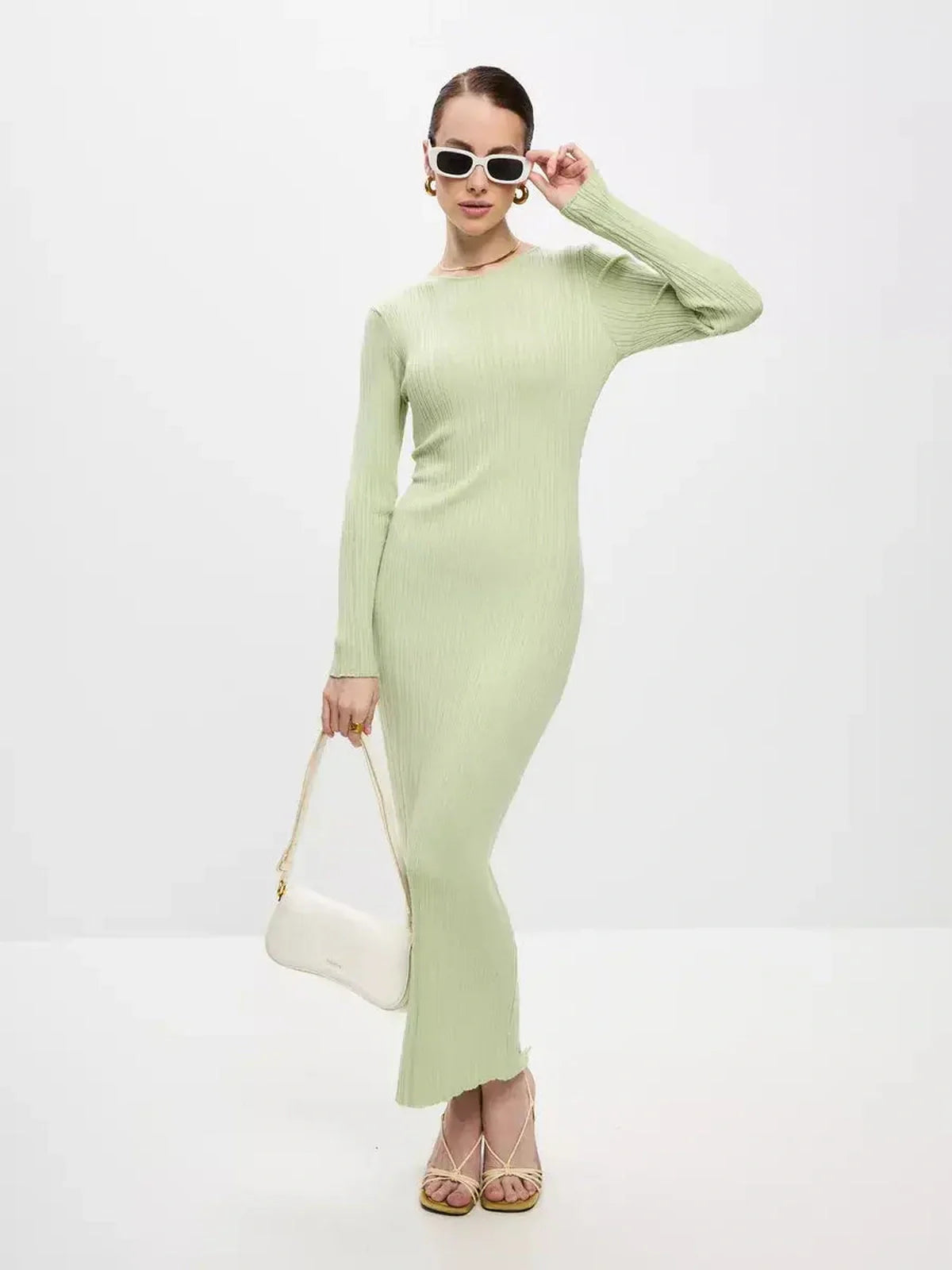 Celery Luxe Maxi Dress in light green, ribbed knit, featuring long sleeves and a sculpted fit for elegant occasions.