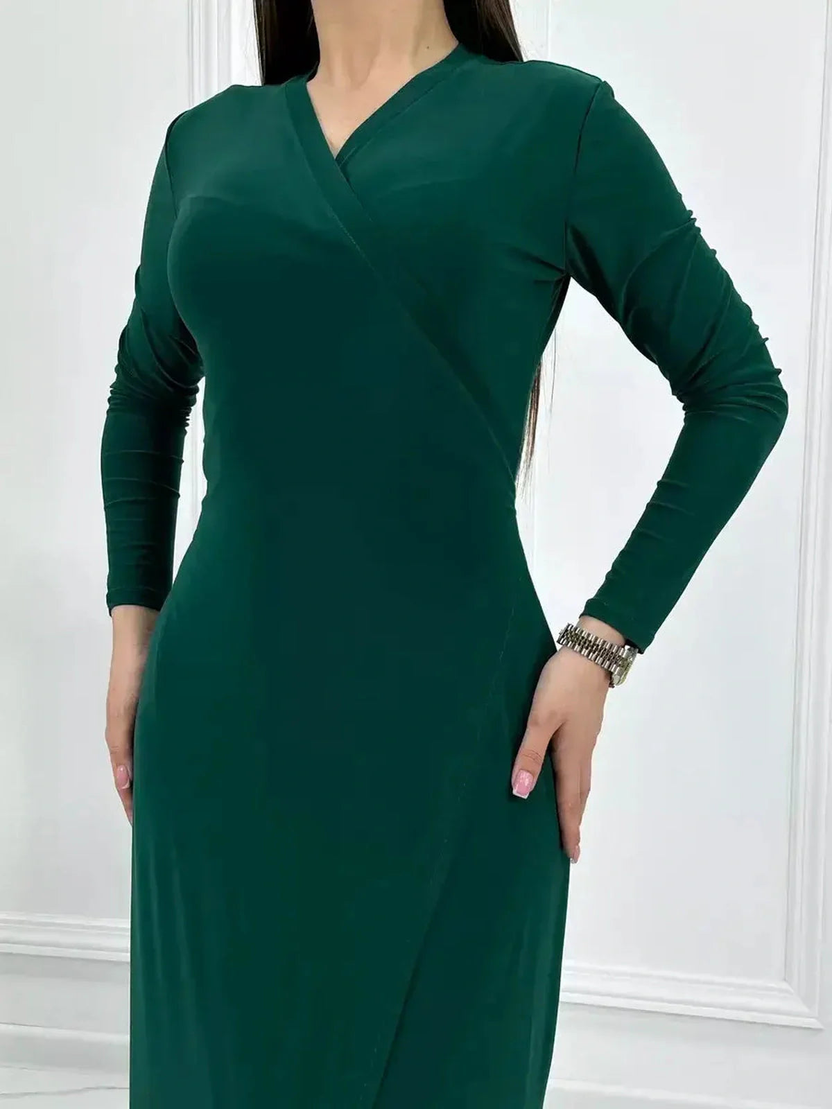 Emerald Allure Maxi Dress featuring an elegant wrap silhouette and fluid drape, perfect for special occasions.
