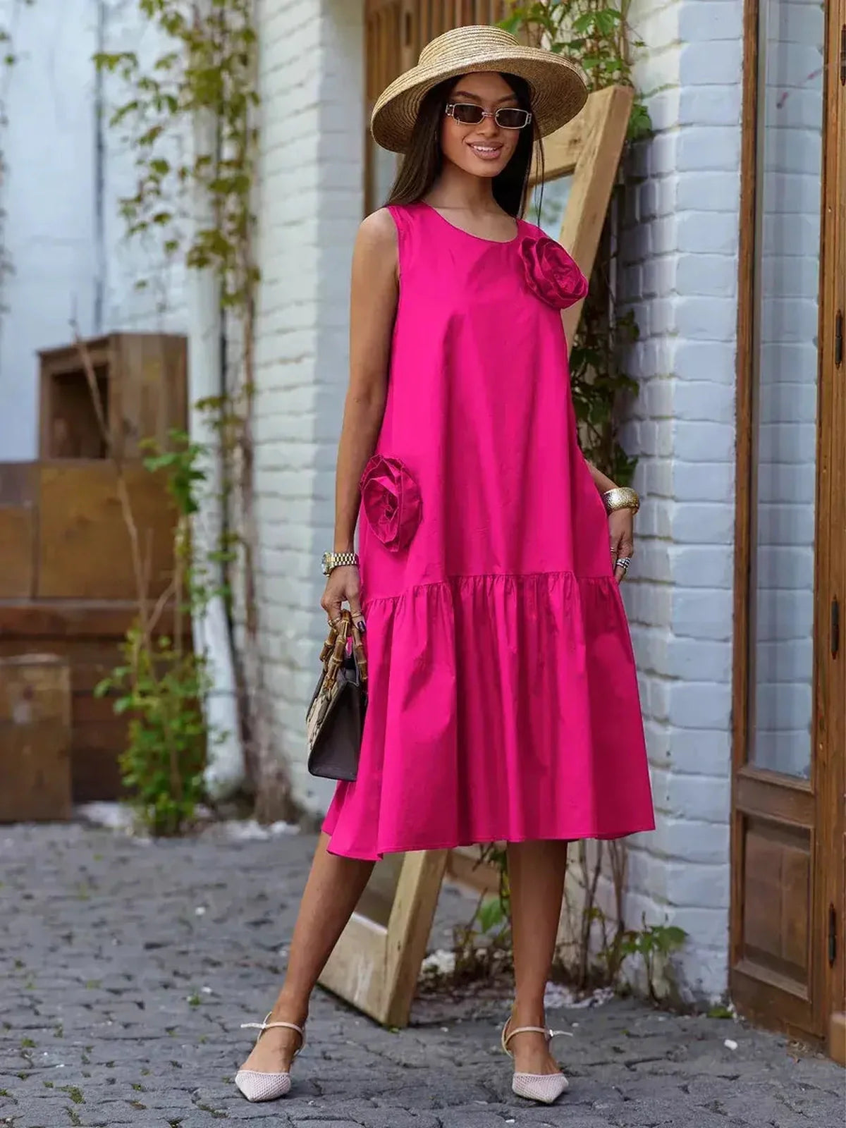 Vibrant fuchsia Rosette Charm Midi Dress with 3D floral accents and tiered hem, perfect for summer occasions.