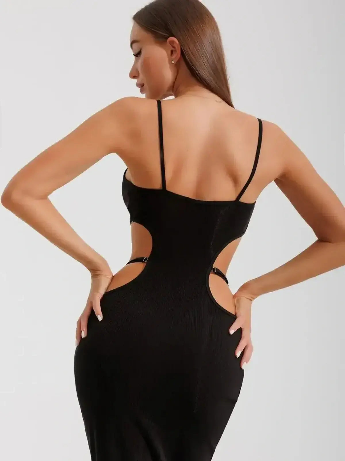 Back view of the Midnight Silhouette Midi Dress showcasing cutouts and a body-hugging fit, perfect for formal events.
