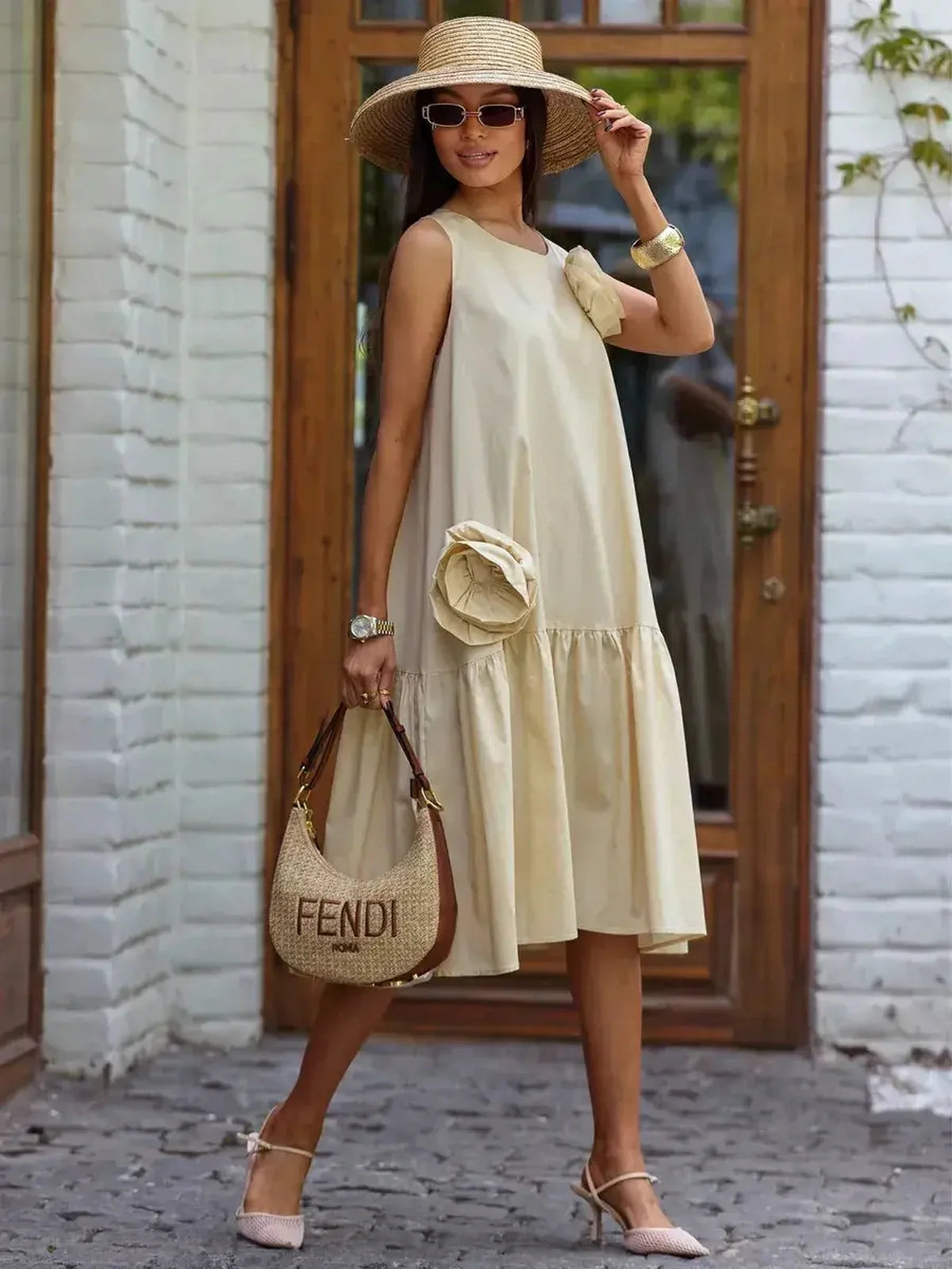 Elegant midi dress in soft champagne with floral appliqué, perfect for weddings and summer events.