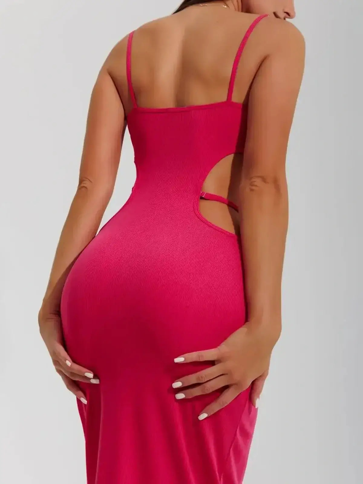 Back view of a body-hugging pink Sculpt Midi Dress with cutouts, perfect for summer events and formal occasions.