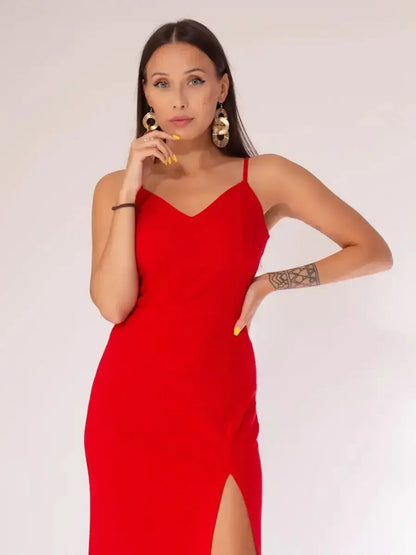 Elegant red midi dress featuring delicate straps and a daring front slit, perfect for cocktail events and summer soirées.