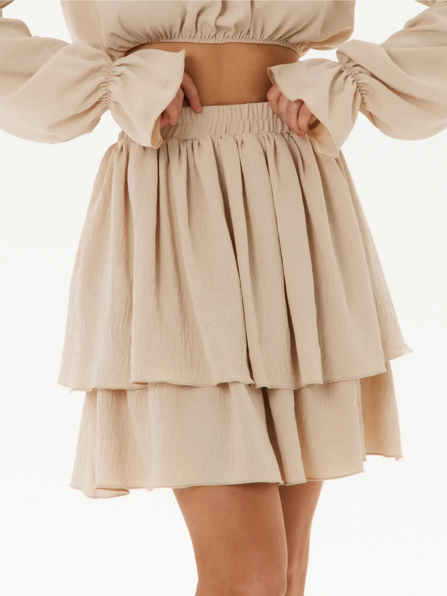 Ruffle Breeze Set tiered mini skirt in beige, perfect for summer dresses, wedding guest outfits, and outdoor events.