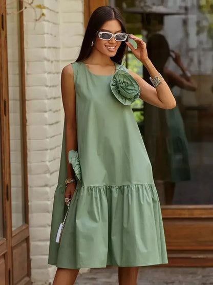 Petal Bloom Midi Dress in green, showcasing floral accents and flared hem, ideal for weddings, graduations, and summer events.