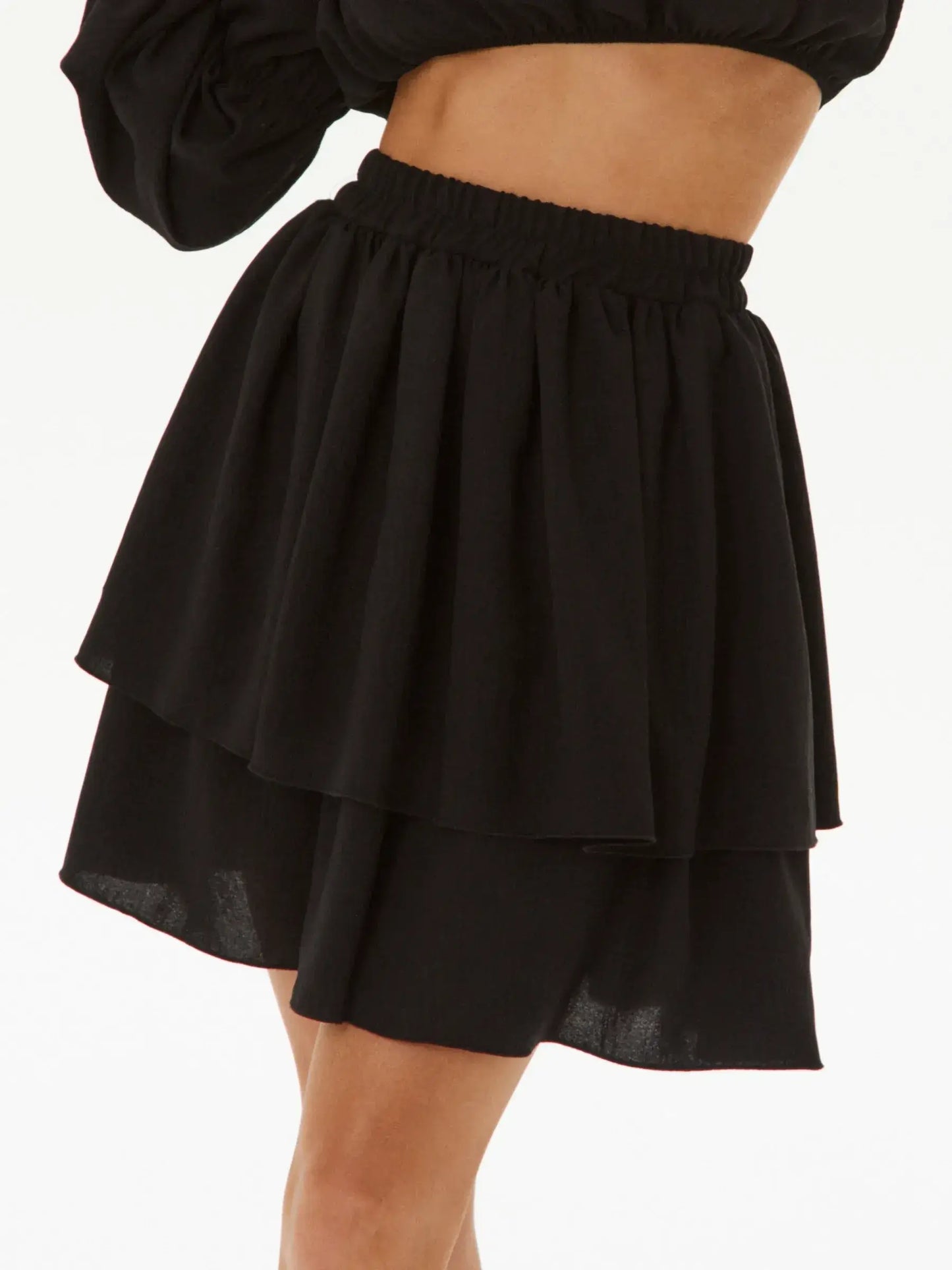 Ruffle Muse two-piece set featuring a layered black tiered skirt, perfect for summer dresses or cocktail attire.