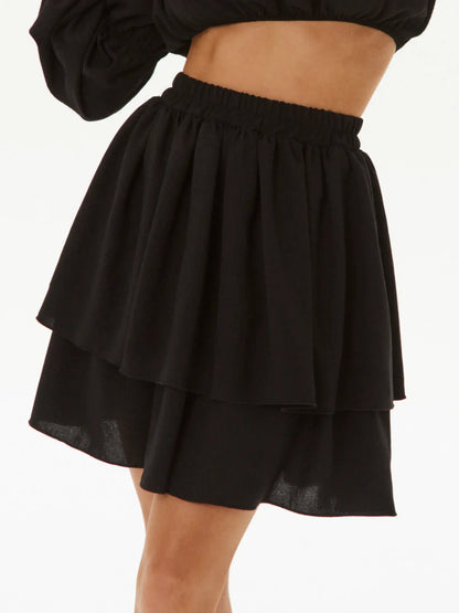 Ruffle Muse two-piece set featuring a layered black tiered skirt, perfect for summer dresses or cocktail attire.