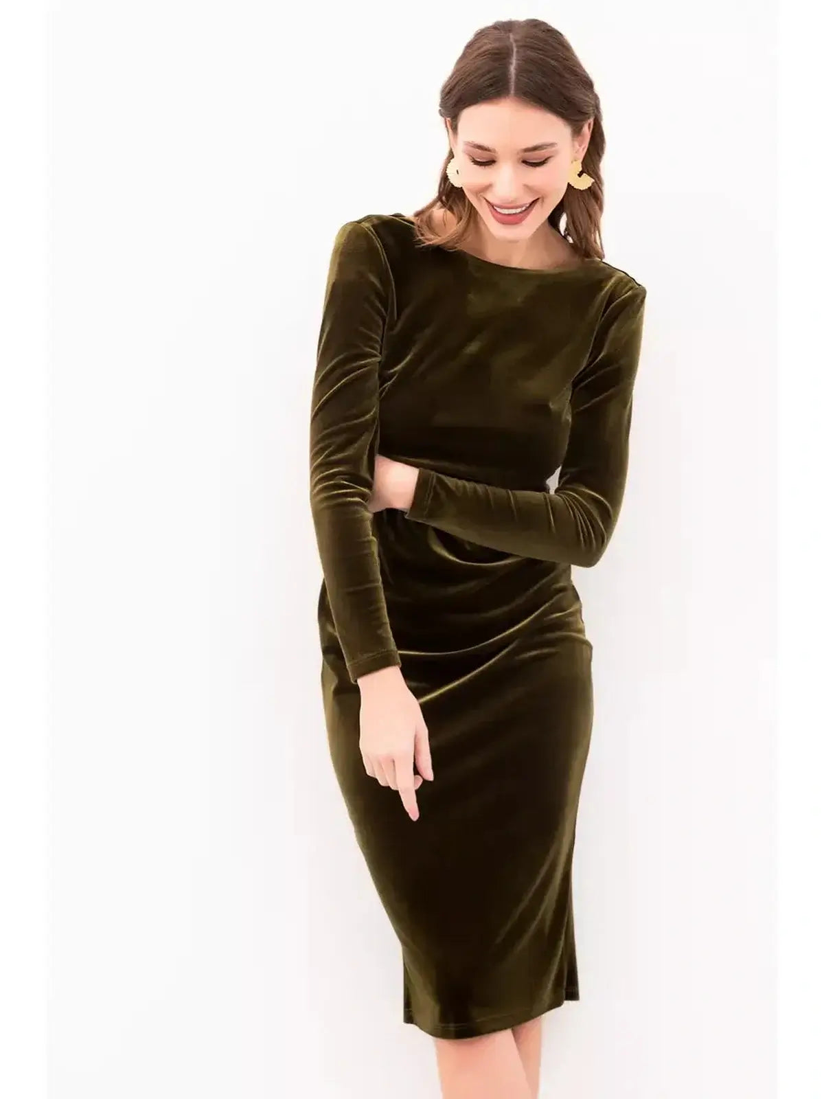Model wearing the Velour Grace Midi Dress in khaki velvet, featuring a sleek silhouette and stylish open back.