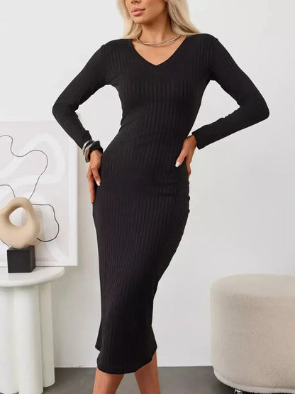 Muse Midi Dress in black, featuring a sculpted ribbed design, V-neckline, and long sleeves for a sleek silhouette.