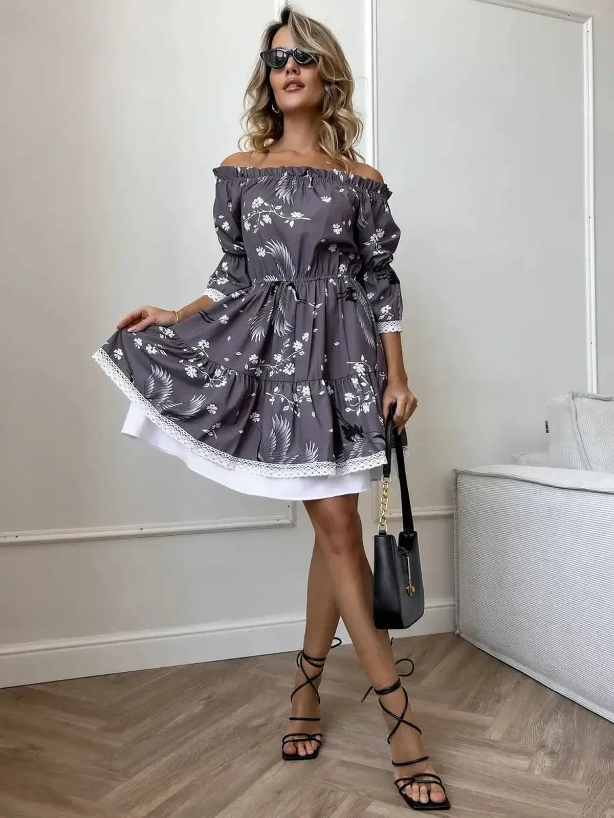 Sakura Flight mini dress featuring off-shoulder neckline, ruffled sleeves, floral design, perfect for summer or wedding guests.