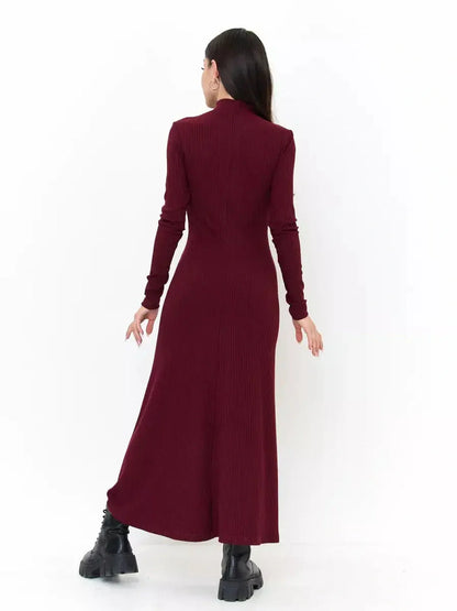 Back view of a burgundy Velvet Edge Midi Dress with long sleeves and a flowing silhouette, showcasing its elegant design.