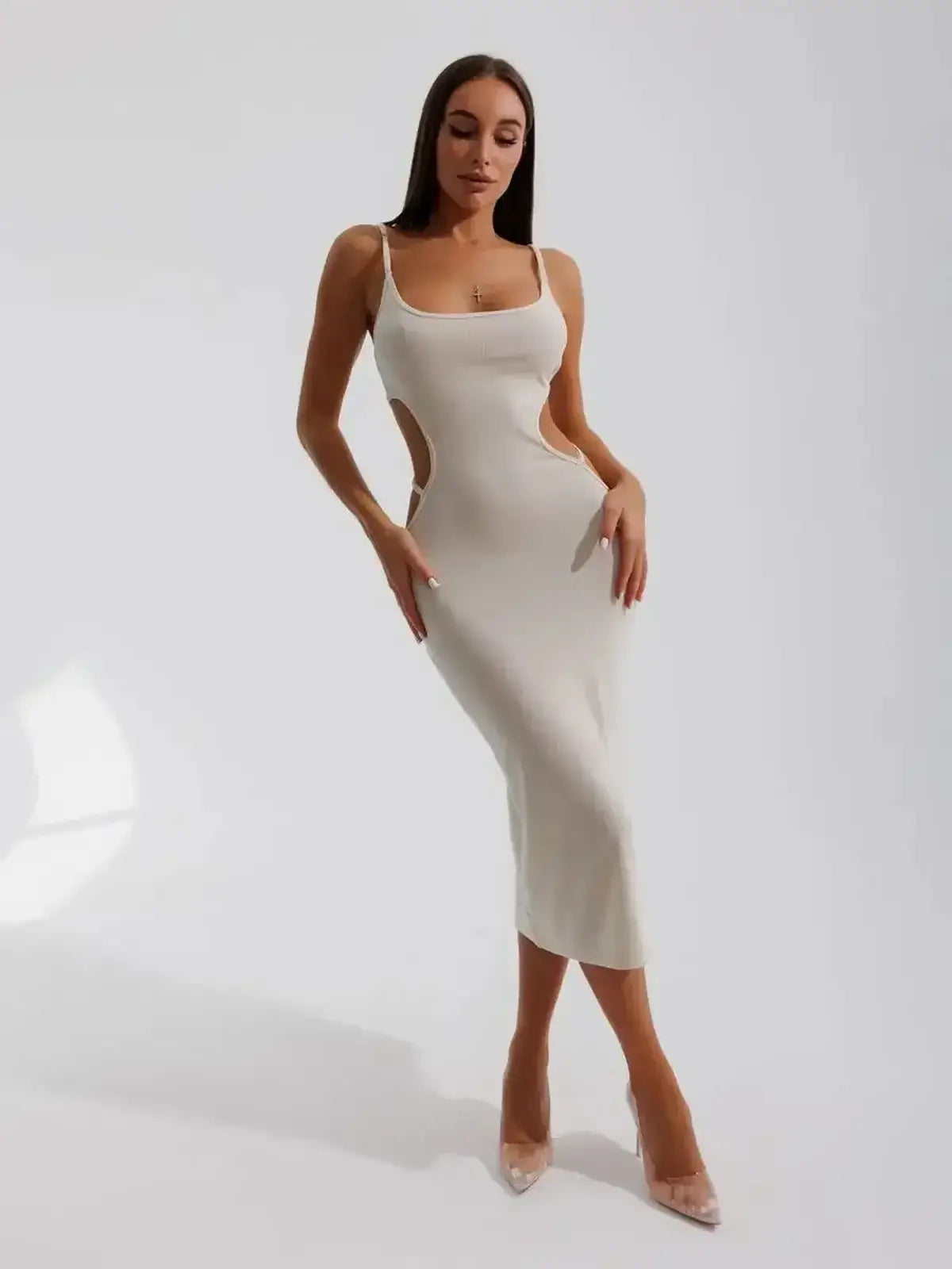 Beige Midi Dress Seraphine featuring sculptural side cutouts, form-fitting design, and elegant scoop neckline.