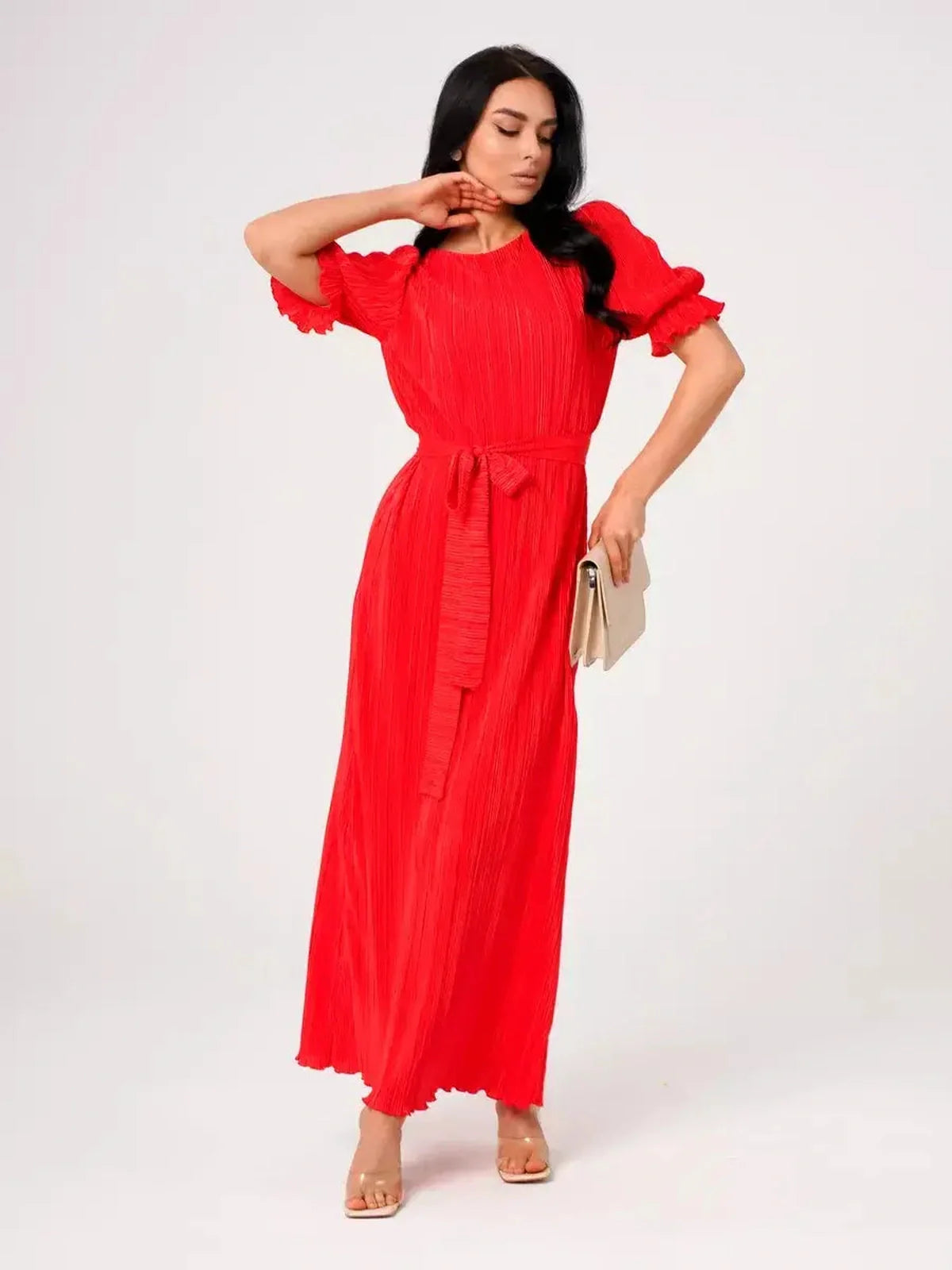 Red Maxi Dress Solaria featuring pleated elegance and a belted waist, perfect for summer events or weddings.
