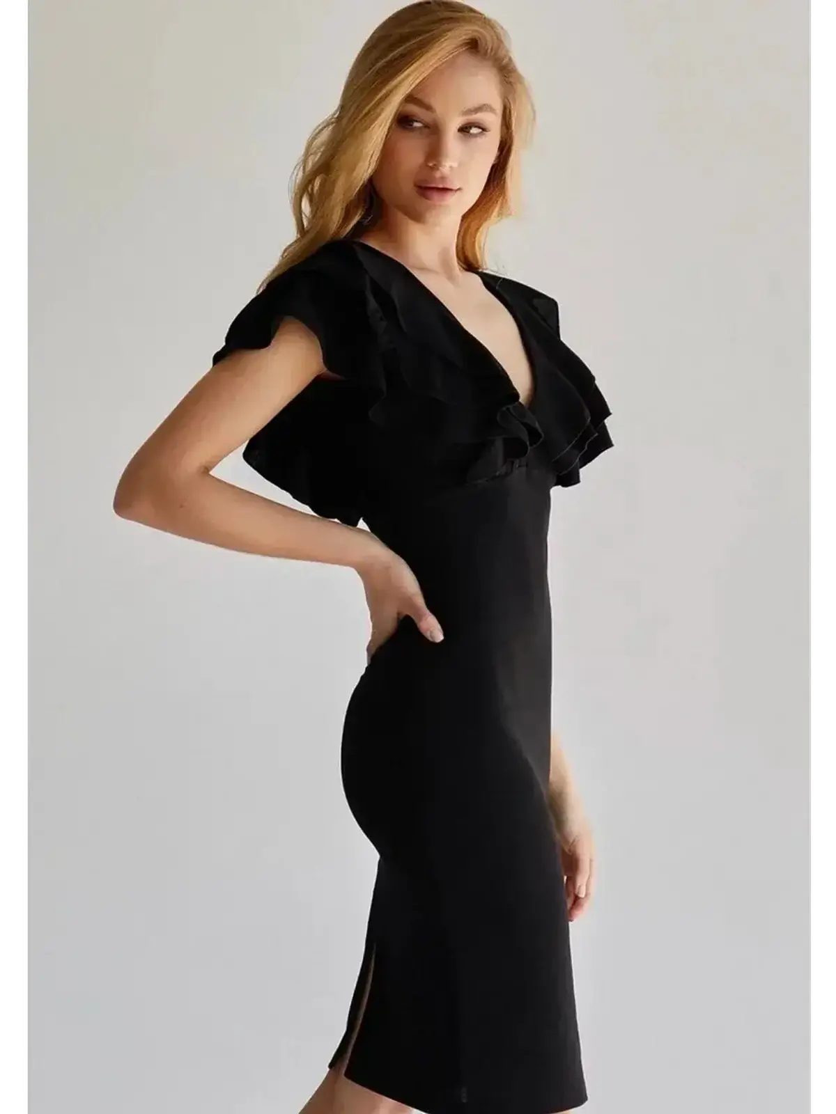 Elegant black mini dress with layered ruffle sleeves and a deep V-neckline, perfect for weddings and formal events.