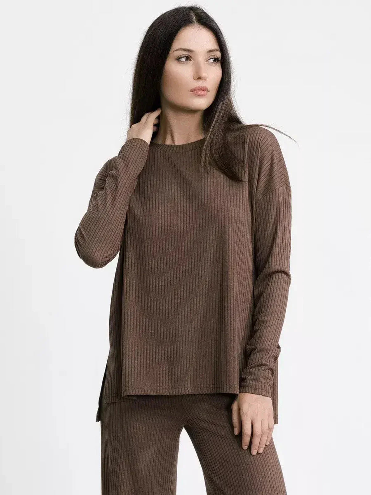Model wearing a soft brown ribbed knit lounge set, showcasing oversized comfort and minimalist design.