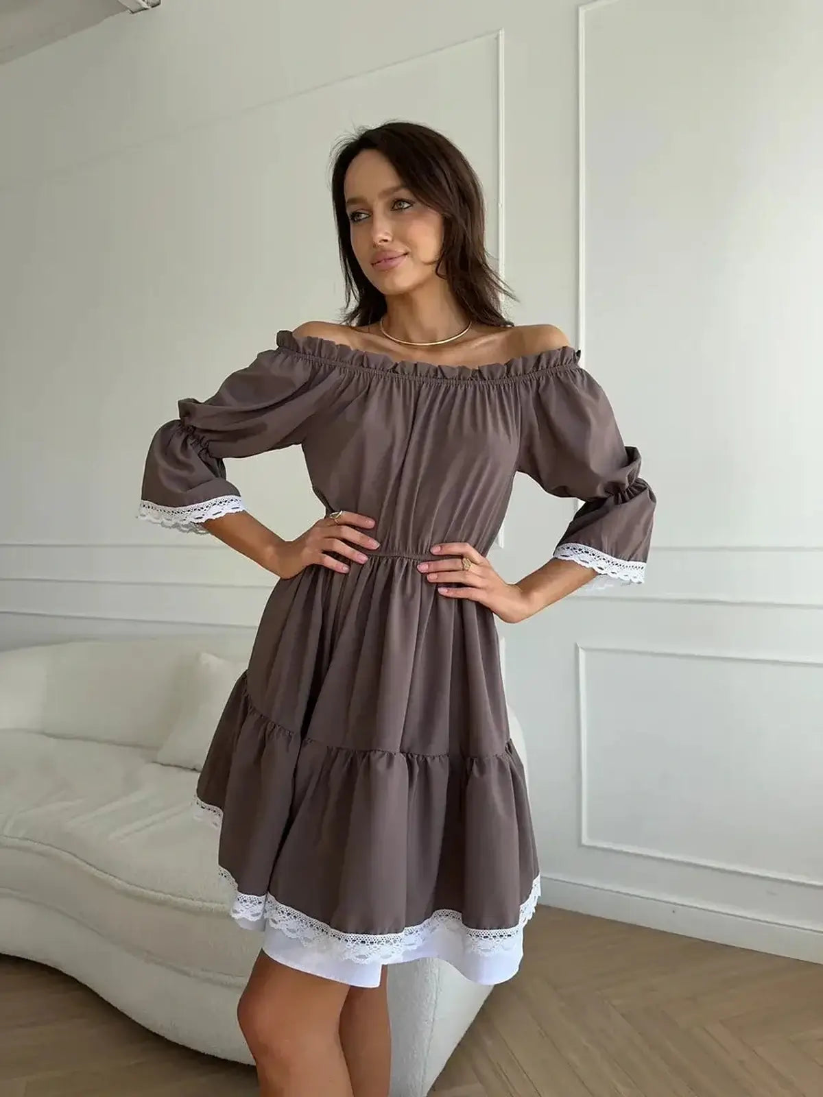 Elegant off-shoulder Mocha Muse mini dress featuring ruffle trim, perfect for summer weddings and casual outings.