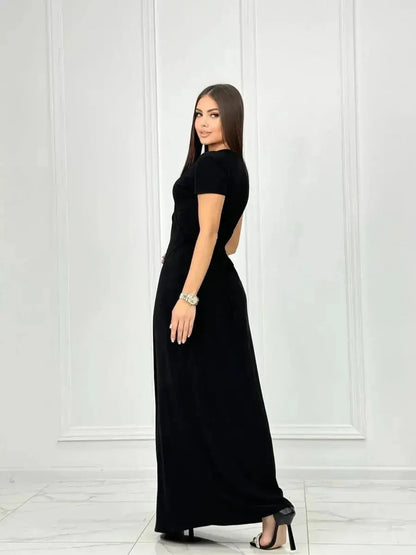 Model showcasing the Obsidian Grace Maxi Dress in elegant black, perfect for formal occasions and summer events.