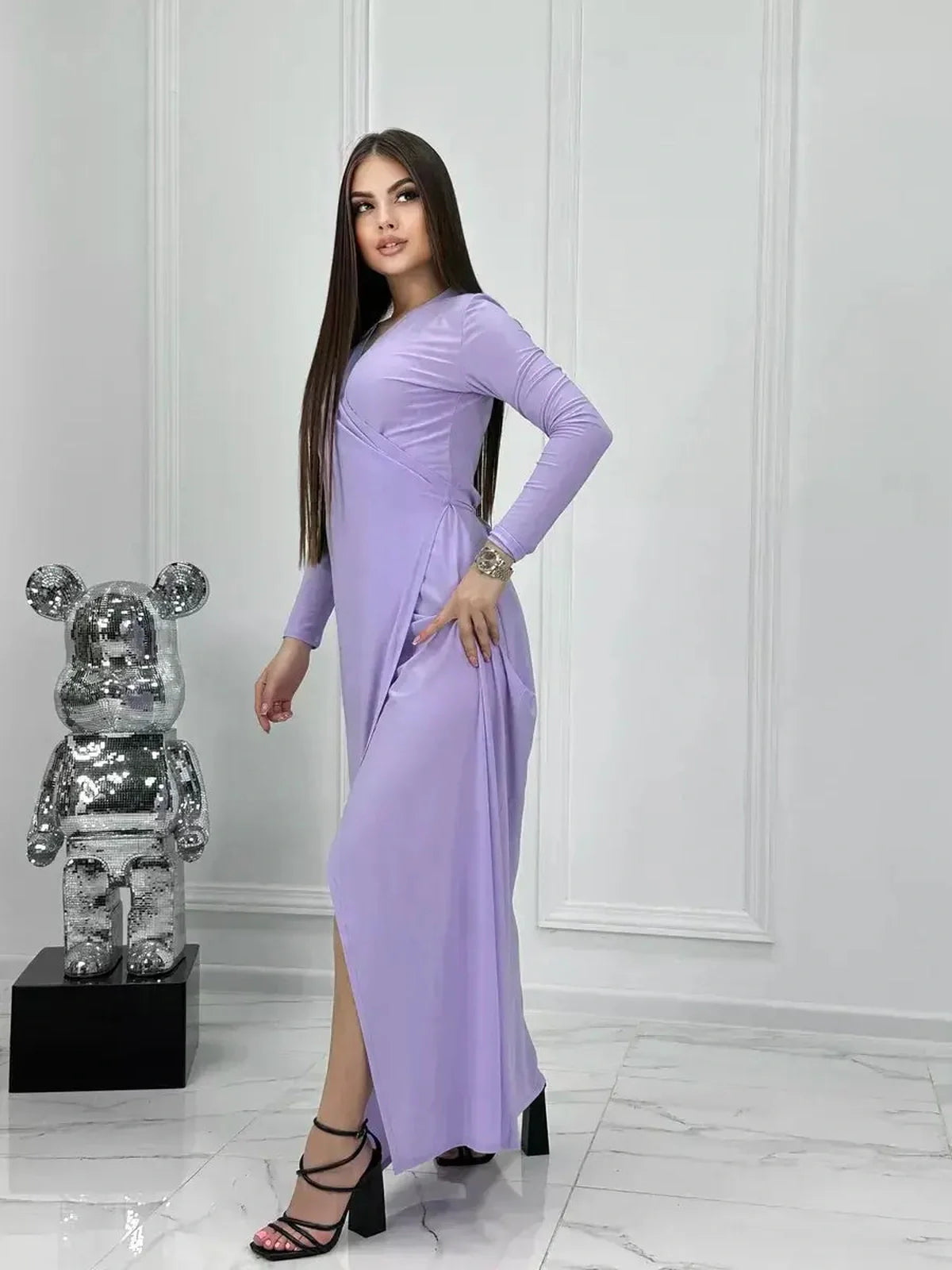 Lilac Mirage Maxi Dress featuring a sleek wrap design and long sleeves, perfect for weddings and summer events.