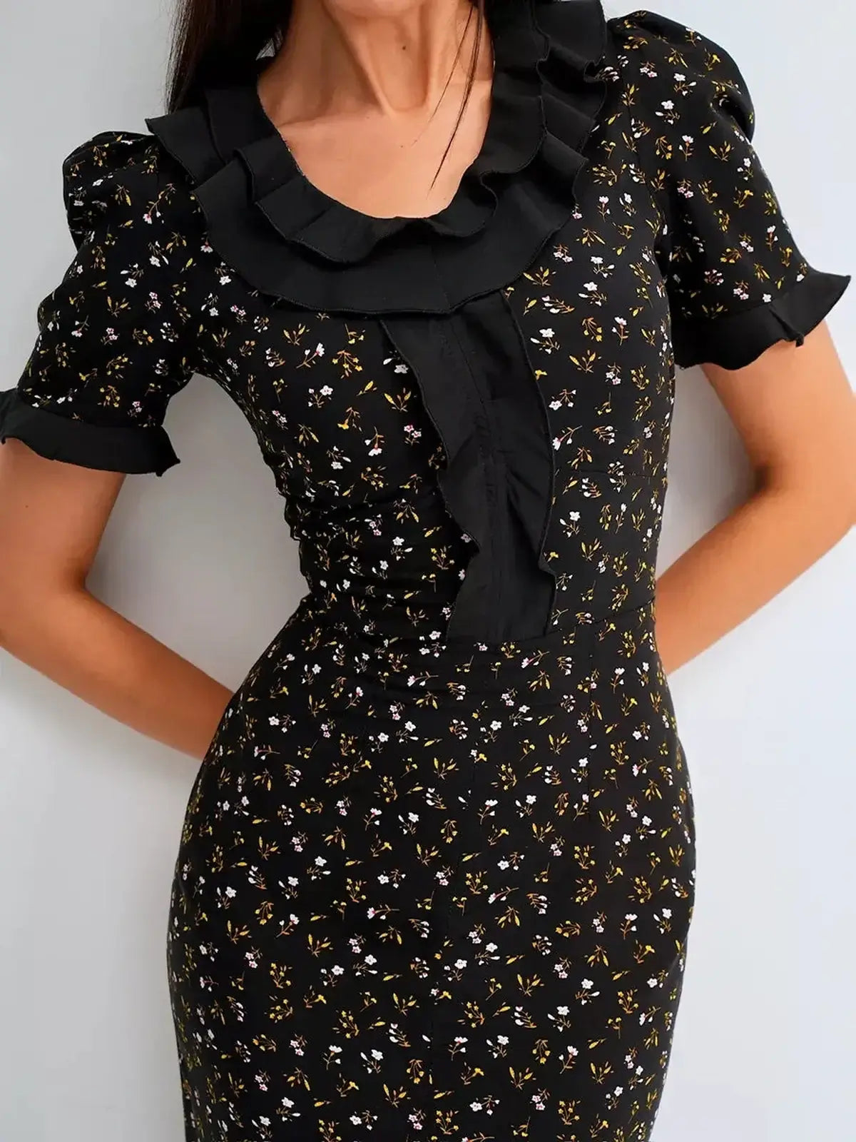 Elegant black midi dress featuring floral prints and ruffles, perfect for weddings, prom, and summer occasions.