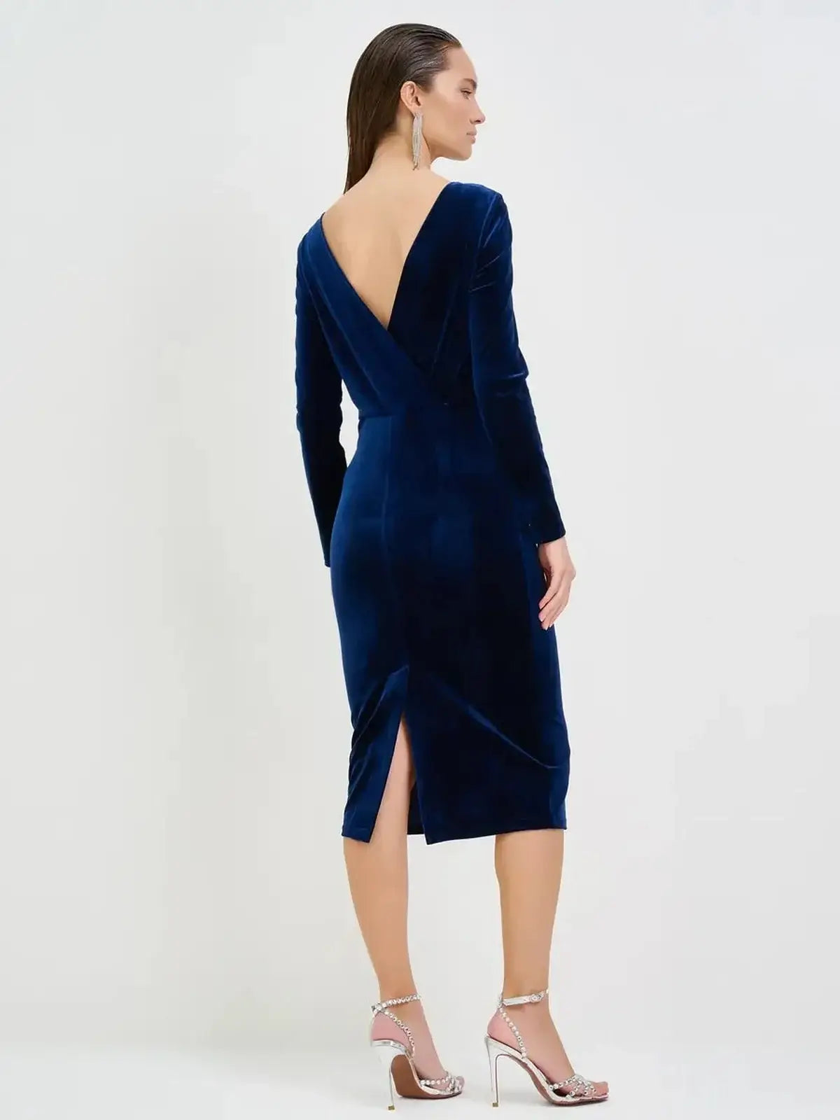 Back view of a sleek navy velvet midi dress with a plunging V-back, perfect for formal occasions and elegant events.