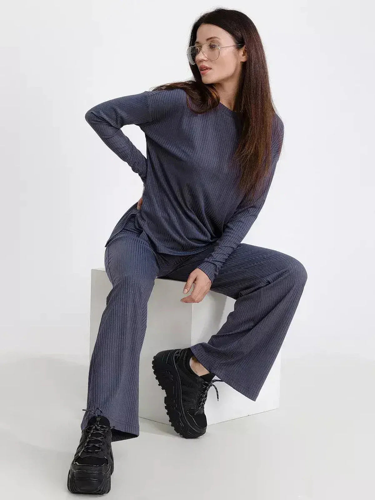 Slate Lounge Set features oversized ribbed knit top and wide-leg pants, blending comfort and modern style for effortless wear.