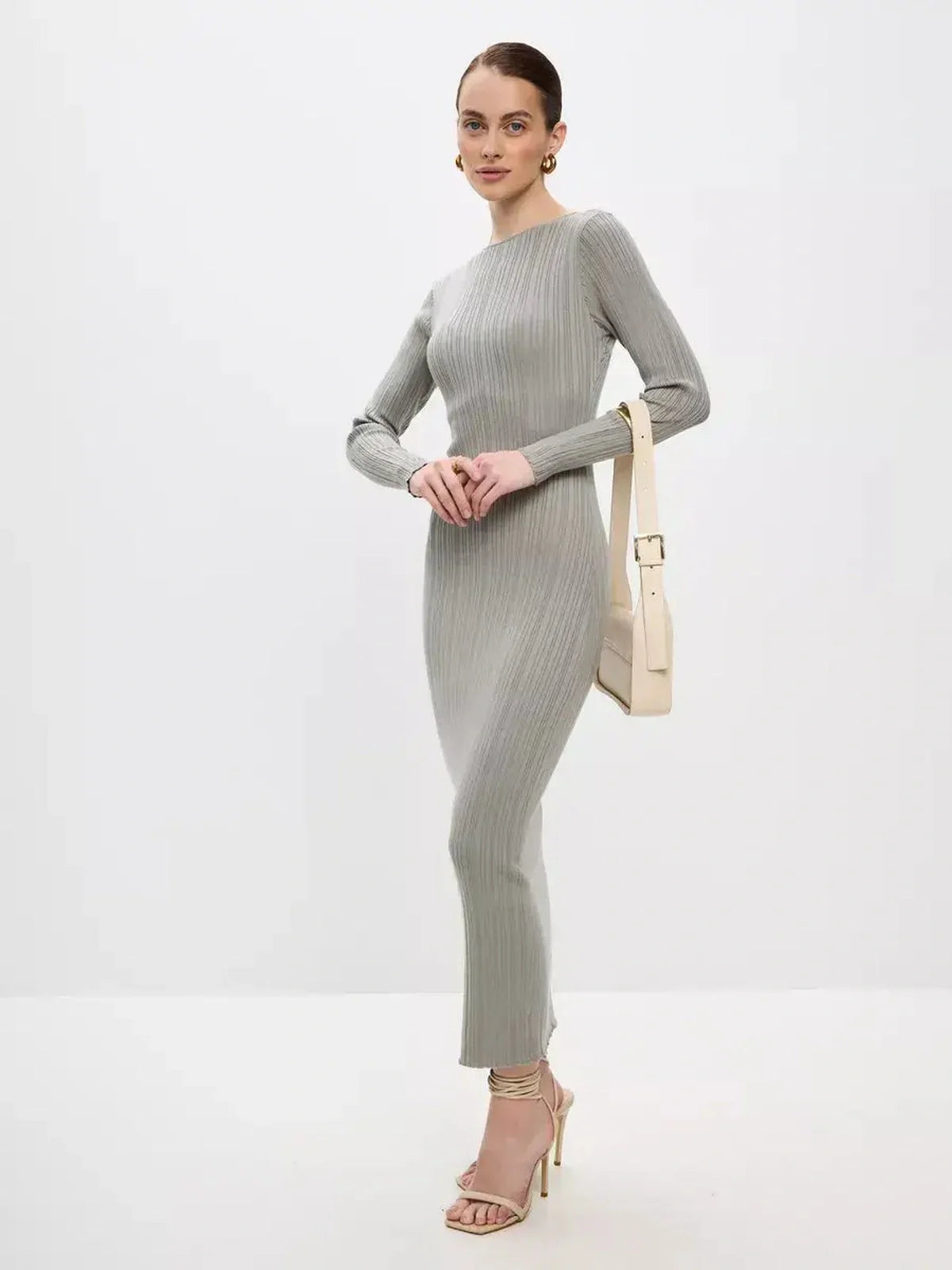 Sculpted Grace Maxi Dress in soft ribbed knit, showcasing elegant silhouette perfect for weddings and special events.