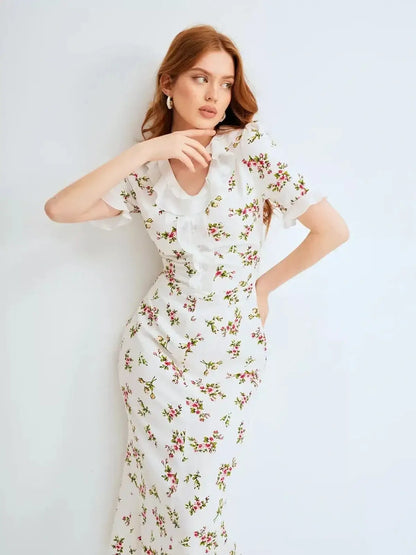 Elegant Roselle Midi Dress with ruffle collar and romantic floral print, perfect for summer weddings and formal occasions.