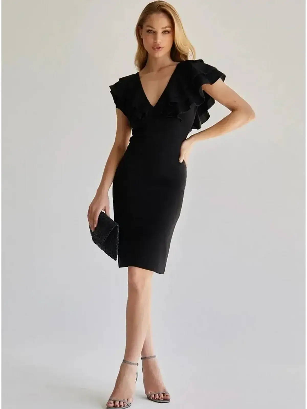 Elegant black mini dress with ruffle sleeves and deep V-neckline, ideal for formal events and weddings.
