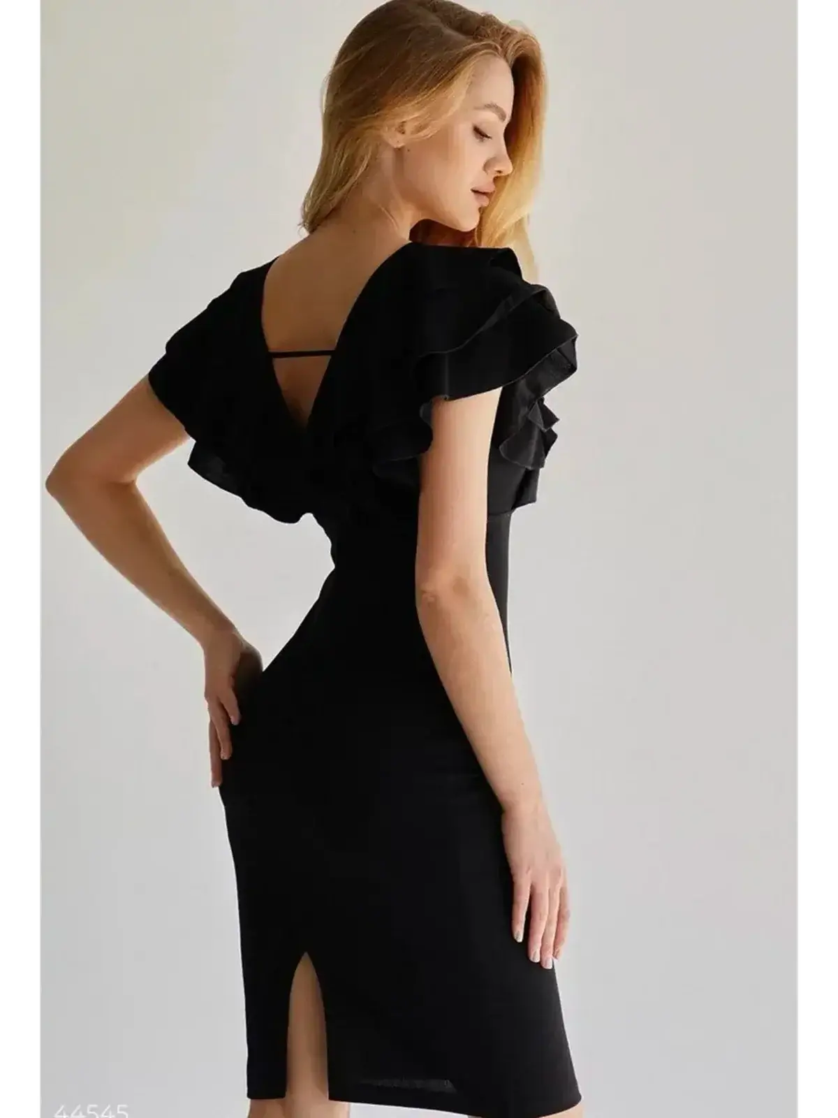 Ruffle Muse black mini dress with ruffle sleeves and open back, perfect for weddings and formal events.