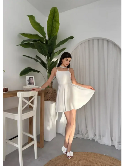 Elegant white summer dress with lace back, perfect for weddings, graduations, and formal occasions.