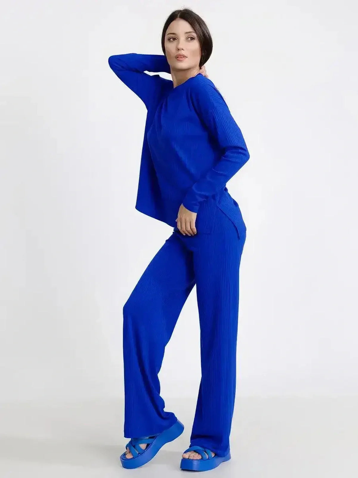 Stylish woman in an electric blue lounge set, exuding comfort and elegance, perfect for casual outings or home wear.