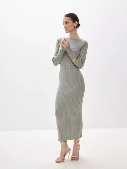Sculpted Grace Maxi Dress in soft ribbed knit, featuring a sculptural fit and long sleeves for elegant occasions.