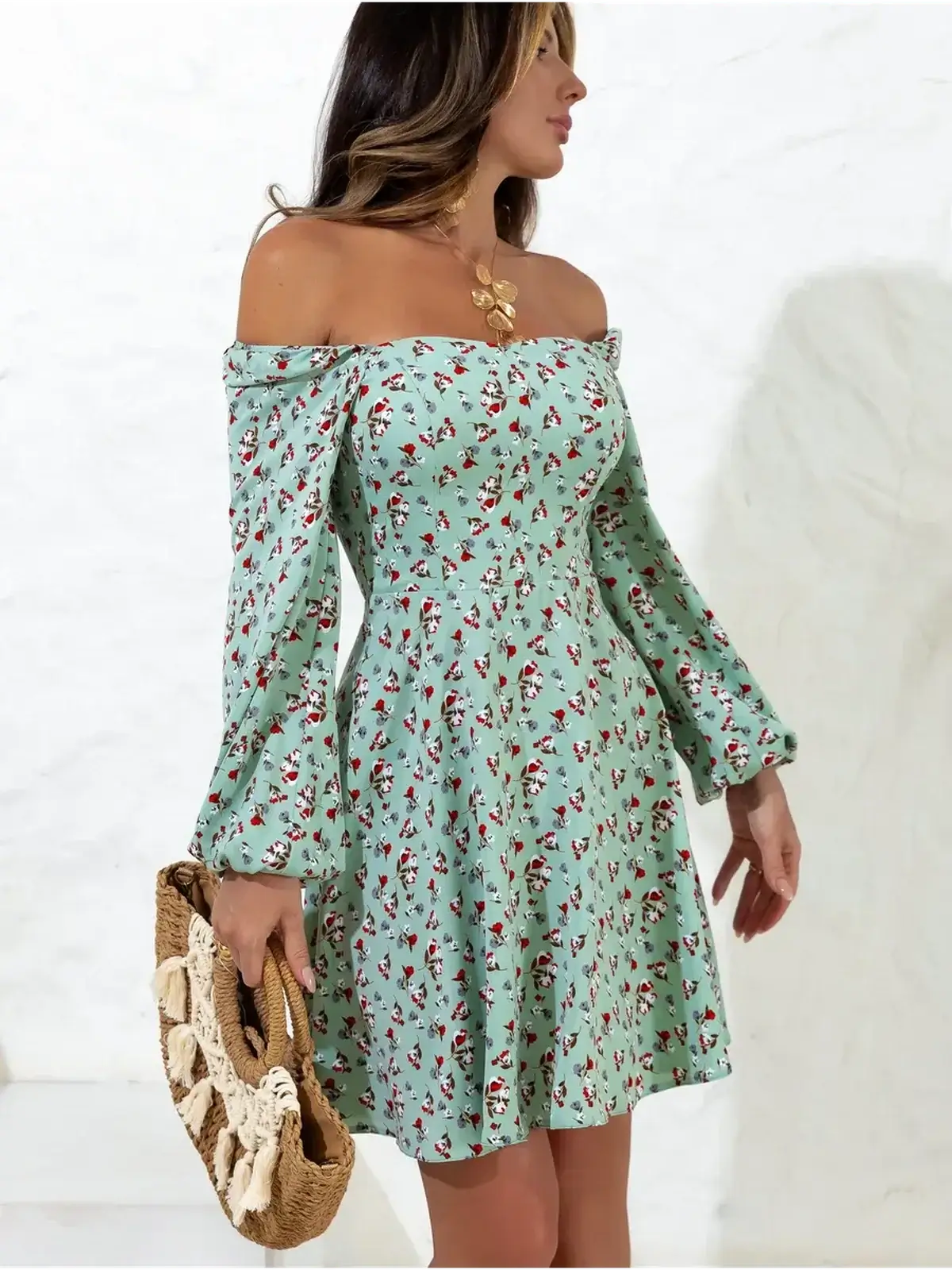 Light green mini dress with floral print, off-shoulder style, perfect for summer weddings and casual outings.