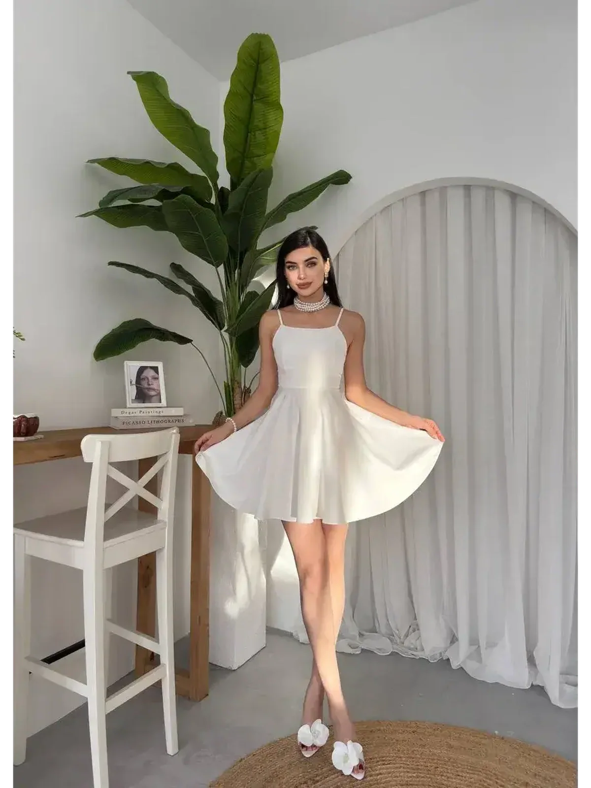White summer dress featured in a stylish A-line silhouette, perfect for wedding guest dresses and graduation outfits.