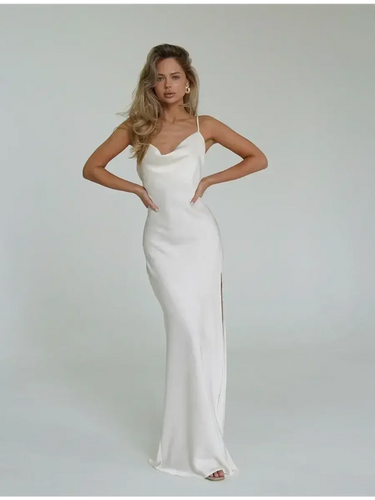 Model wearing an Ivory Luxe Maxi Dress with a cowl neckline and side slit, perfect for summer weddings or formal events.