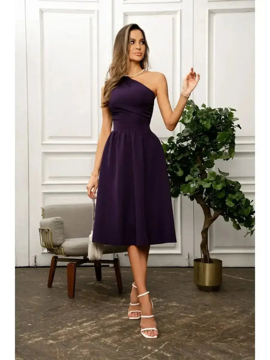 Model wearing a deep purple one-shoulder midi dress, showcasing elegance for weddings and formal occasions.
