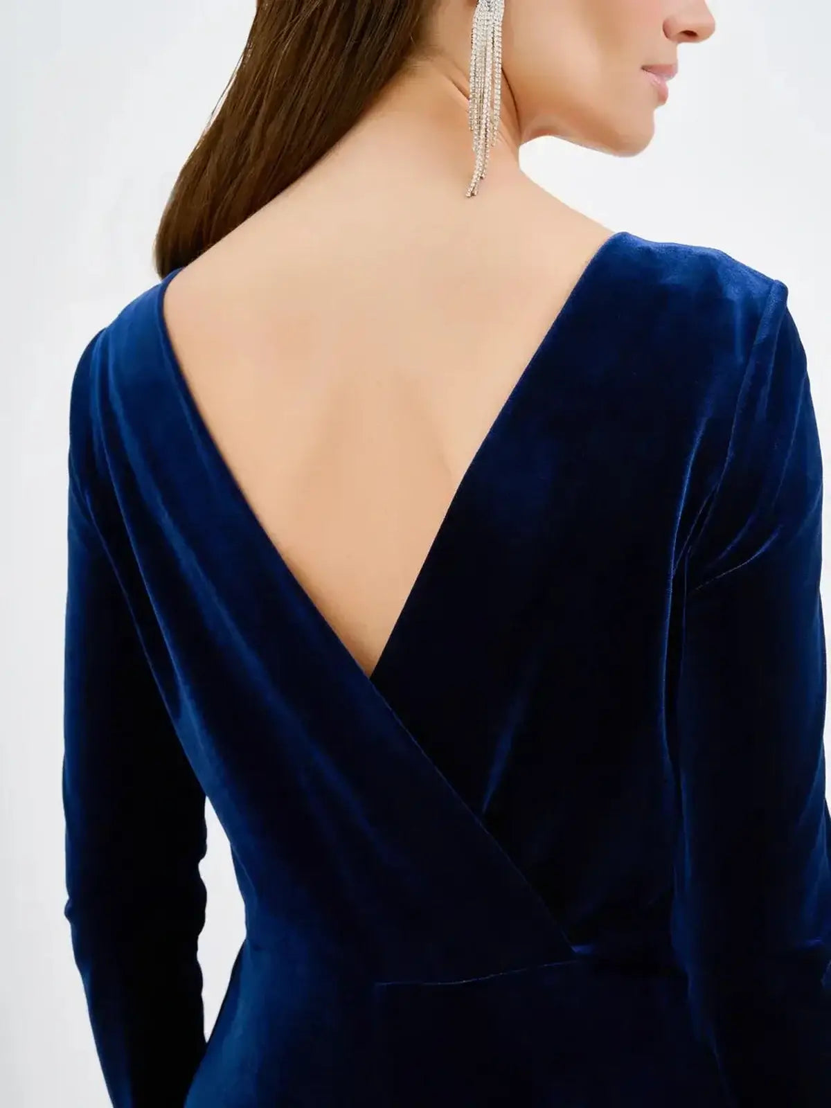 Back view of a Navy Velvet Obsidian Midi Dress showcasing its plunging V-back detail for elegant women's clothing.