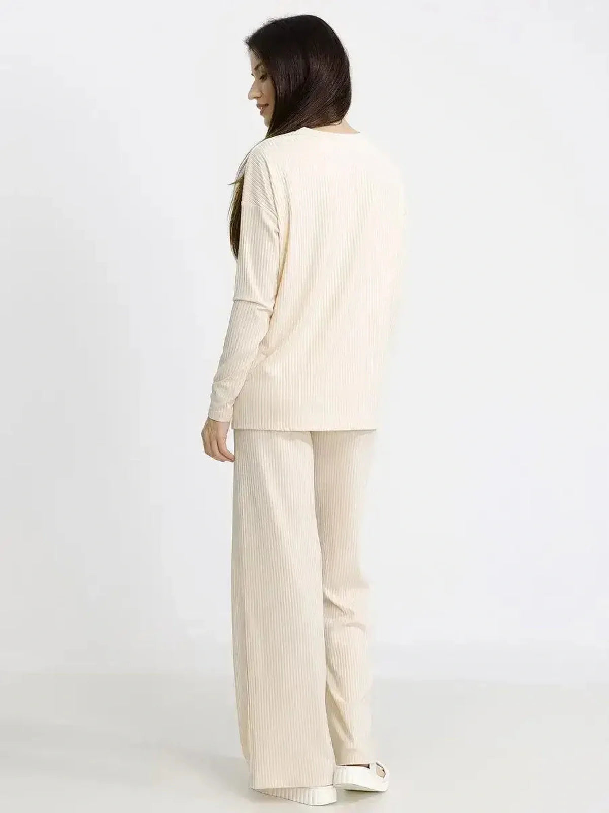 Women in beige melange oversized soft ribbed lounge set, showcasing comfort and style for casual wear.