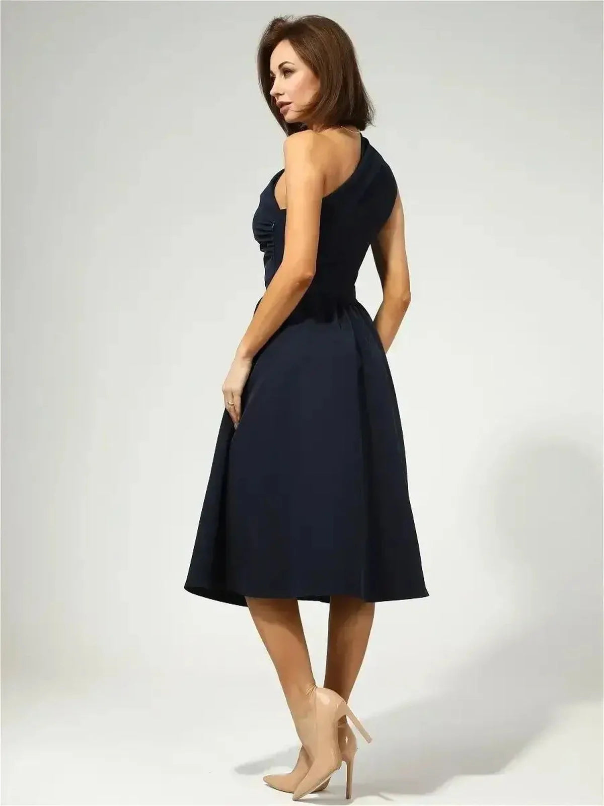 Sculpted Grace Midi Dress in dark navy with asymmetrical design and flared skirt, perfect for weddings and formal events.