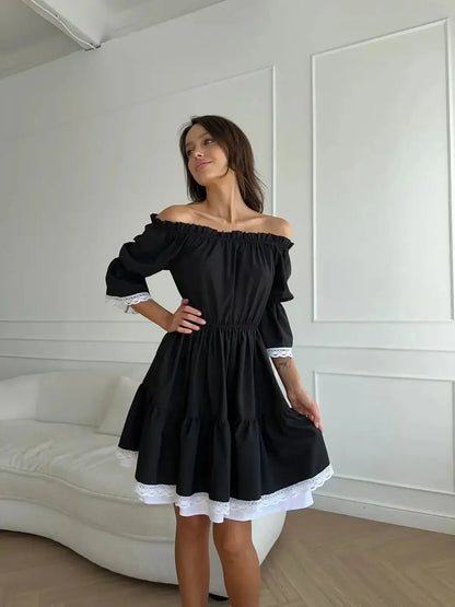 Black mini dress with off-shoulder neckline and white lace trim, perfect for weddings, proms, or summer events.